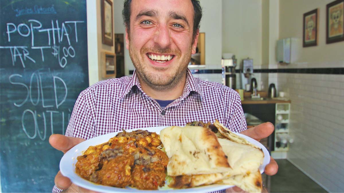 Simon Ghorbani holding curry