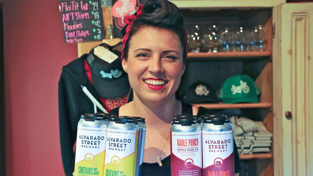 Alvarado Street Brewery brewer Brittany Hobbs holds cans of beer