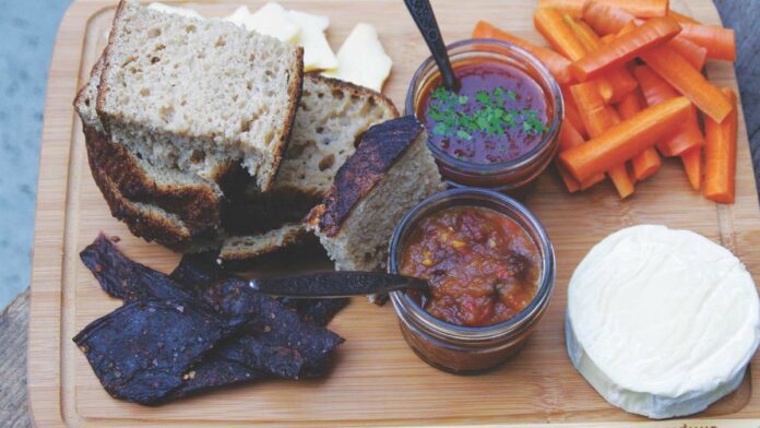 The Heritage Food Project to Present at County History Fair Local preserves on a cutting board with pickles and bread