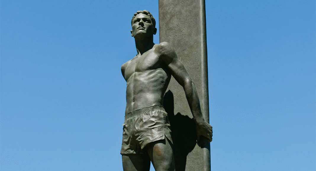 Iconic surf statue on West Cliff Drive in Santa Cruz against a blue sky