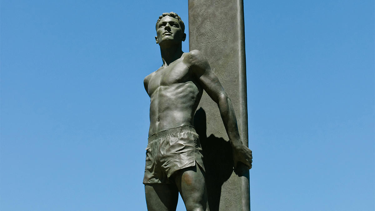 Iconic surf statue on West Cliff Drive in Santa Cruz against a blue sky