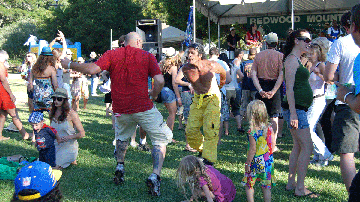 2017 Redwood Mountain Faire people dancing on the grass
