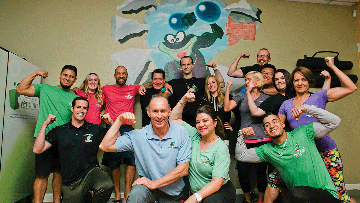 The trainers and staff of Toadal Fitness. Back row: Rudy Larin, Jennyn Jefferson, Nicolas Roure, Shawn Johnston, John Smith, Meigon Duncan, John McFadden, Travis Trinh. Middle Row: Michael Harbison, Marie Cambern, Moniquette Kaduk, Axel Ortiz. Front + Center: Christophe and Cecile Bellito. PHOTO: KEANA PARKER