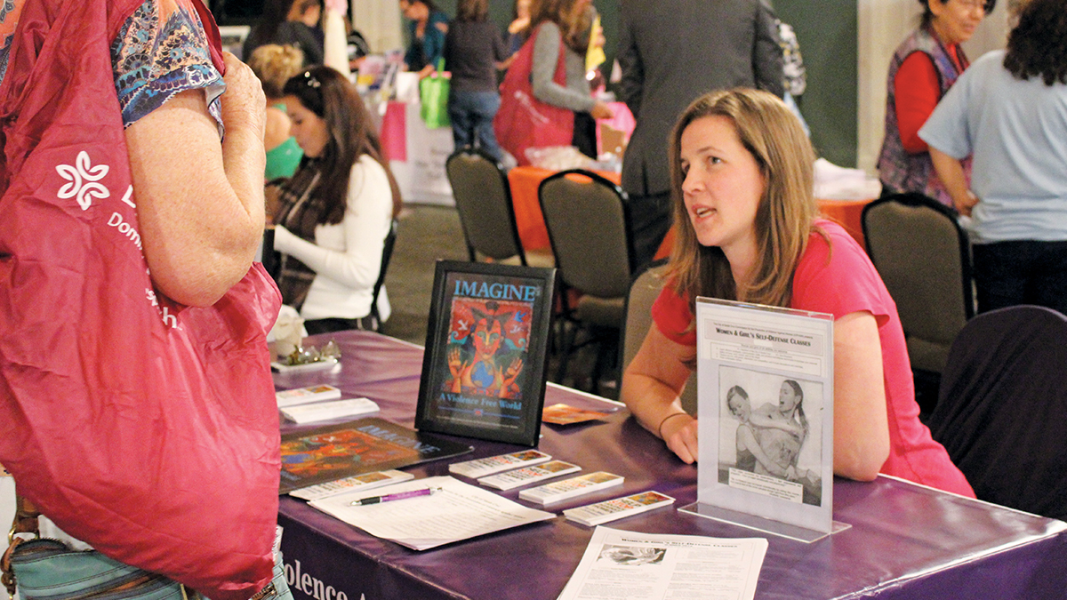 Brooke Newman, chair of the Commission for the Prevention of Violence Against Women tables for self-defense classes