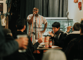 Diversity Center Unveils Additional Support for Trans Youth Ezra Bowen, the new transgender program coordinator for the Diversity Center, addresses the crowd at a recent open mic. PHOTO: KEANA PARKER