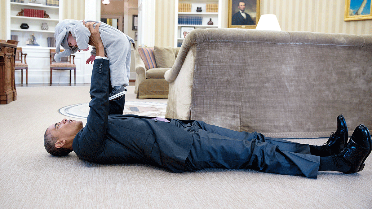 Pete Souza Barack Obama holding a baby