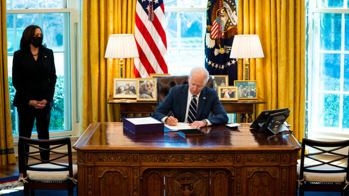 Biden Signs Stimulus Bill Ahead of Prime-Time Address