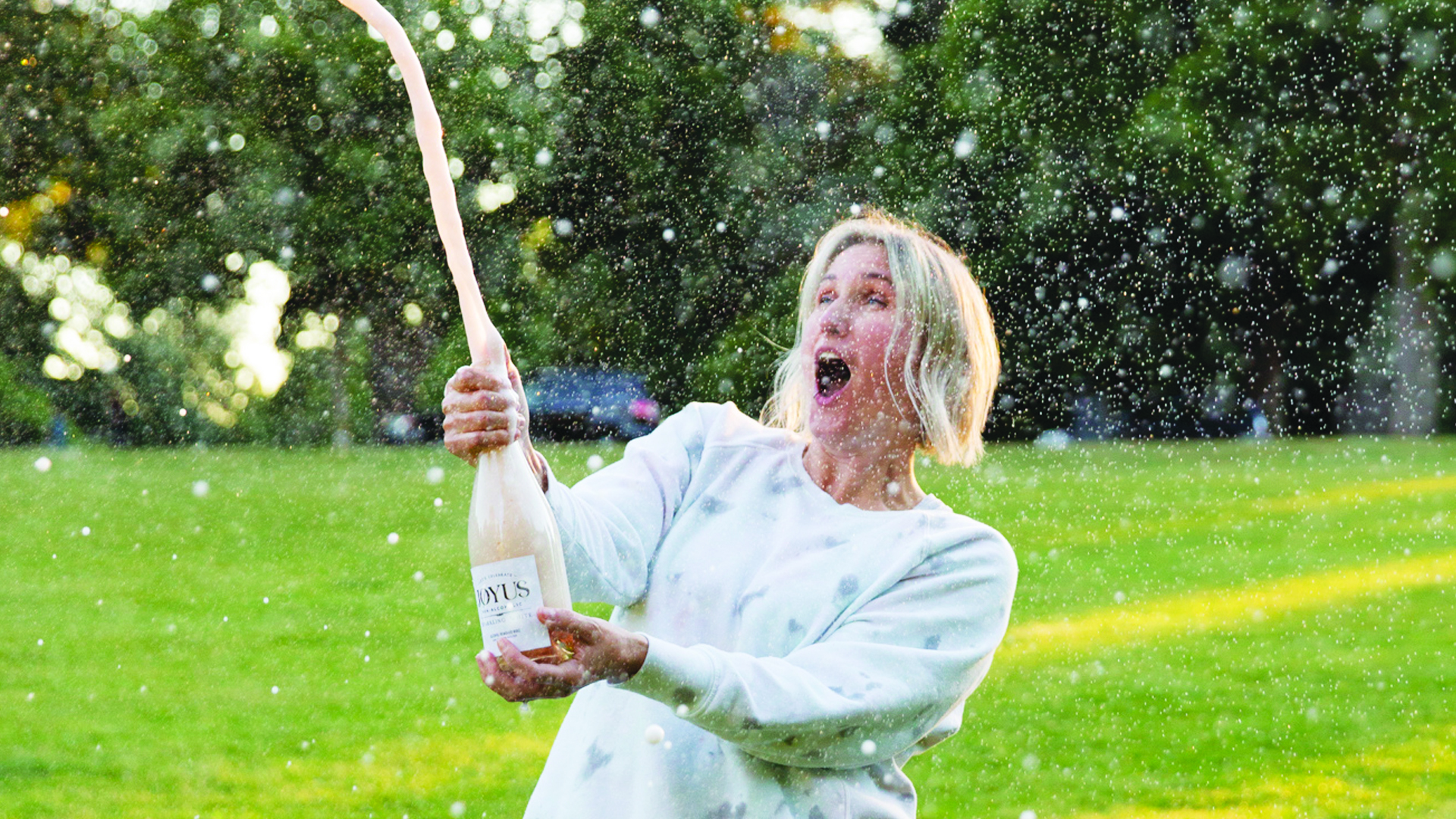 Popping a cork of sparkling wine bottle