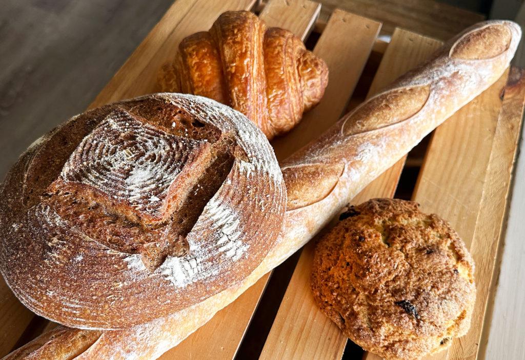 cutting board with four types of bread