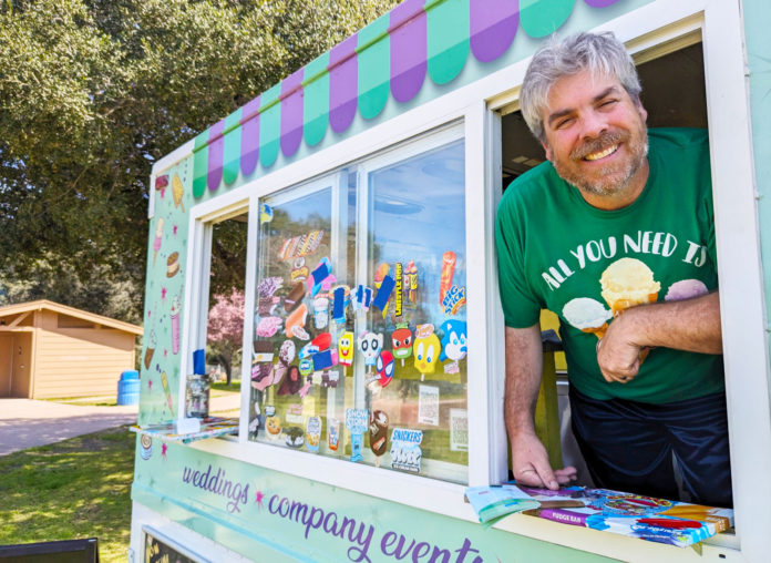 New Leadership Revs Up Food Truck Fridays in Scotts Valley Smiling man leaning out of a food truck