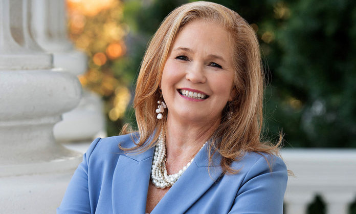Gail Pellerin Addresses New State Housing Laws Blond woman wearing a jacket and pearls, photographed outdoors