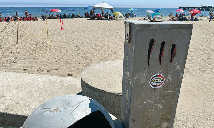 Santa Cruz County to Mull Ban on Filtered Tobacco Products Tall metal receptacle near the beach