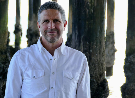 How the California Marine Sanctuary Foundation Scored $71 Million Man standing in front of pilings under a pier