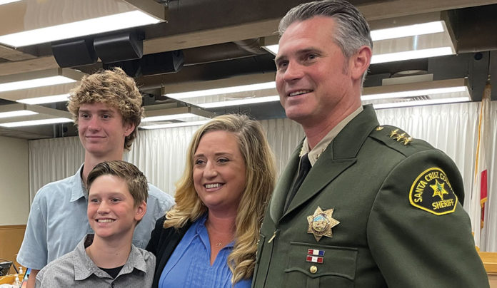 Supervisors Appoint Chris Clark as Sheriff, Effective Dec. 6 Four people standing, one in uniform
