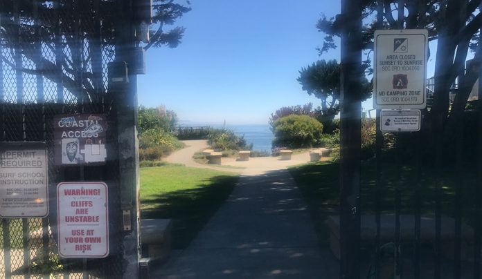 A Privates Beach Hike at High Tide Open gate leading to beach access