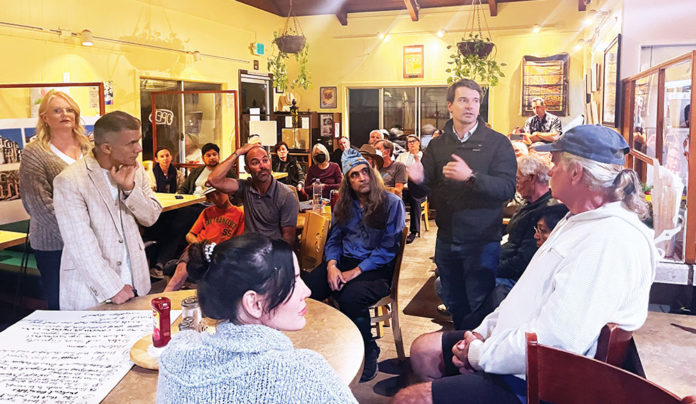 Talk of Plans for Iconic Silver Spur Site Kicks Up Debate Group of people in a room for a meeting