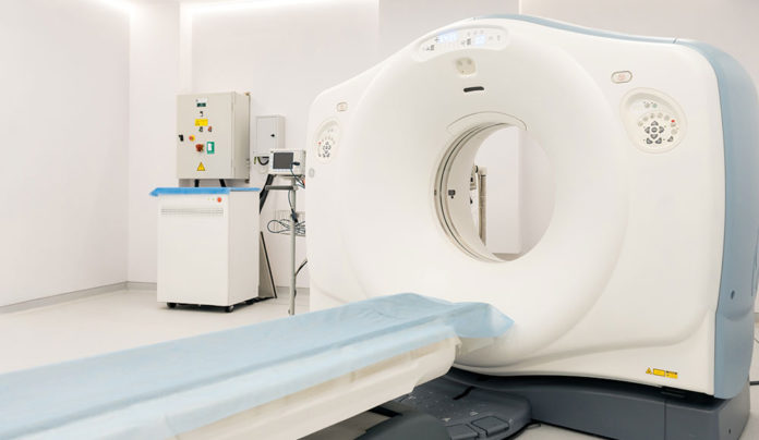 Busts Gone Bad MRI machine in an empty room