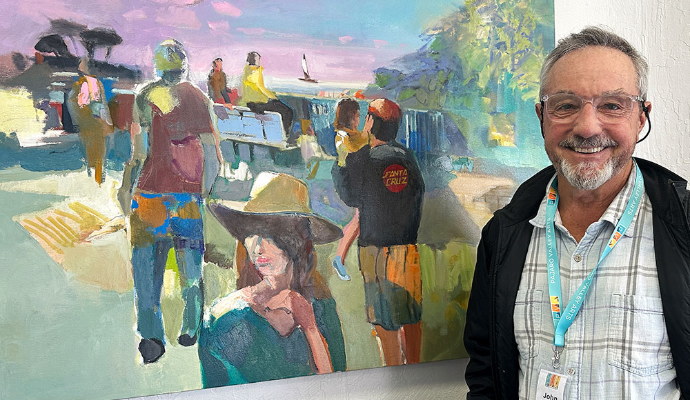 Man standing in front of a painting