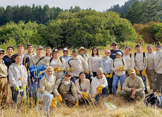 Trust in the Land Group of people out in a field