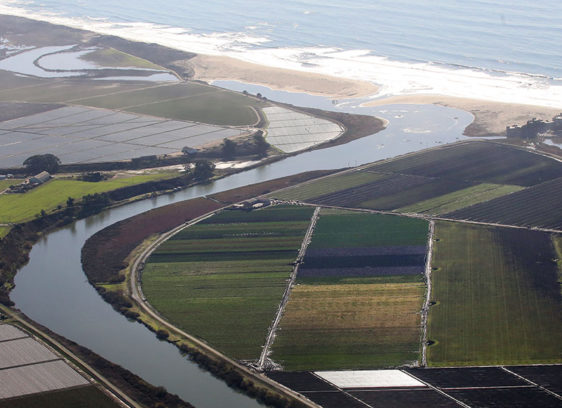 Go with the Flow Aerial view of a river flowing into the ocean, and surrounding farmlands