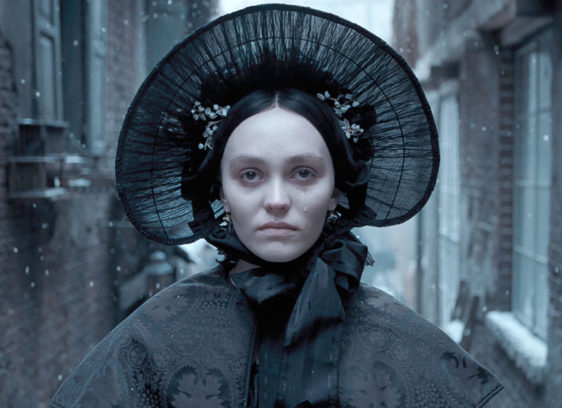 Anybody Really Want to See a Remake of ‘Nosferatu’? Pale-faced woman in Victorian clothing wearing a hat