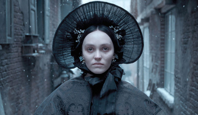 Anybody Really Want to See a Remake of โNosferatuโ? Pale-faced woman in Victorian clothing wearing a hat