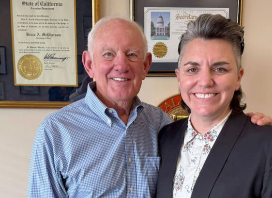 McPherson’s Legacy Man and a woman in an office