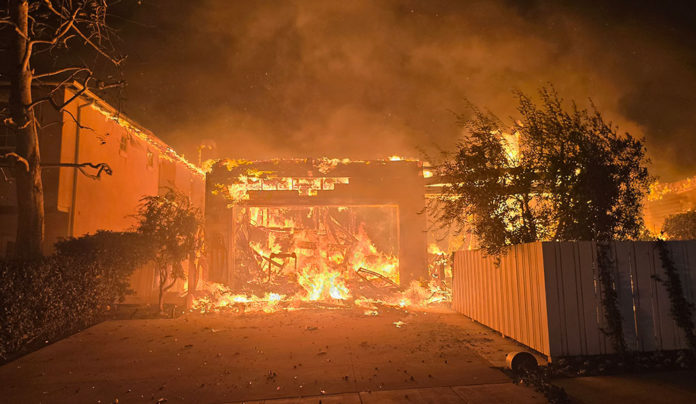 Master of Disaster Photo of a house burning