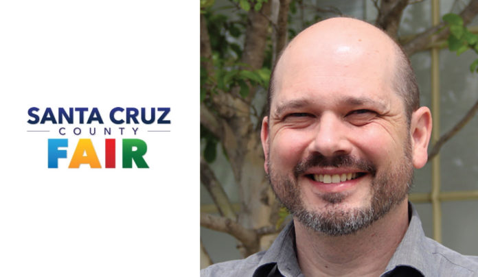 Fair Manager Bids Farewell Man next to a logo of the Santa Cruz County Fair