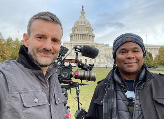 Housing Matters Hosts Screening at the Rio Two men standing in front of the Capitol building