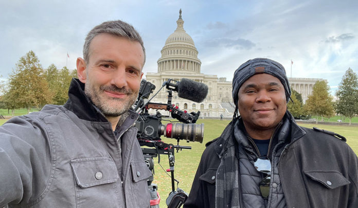 Housing Matters Hosts Screening at the Rio Two men standing in front of the Capitol building