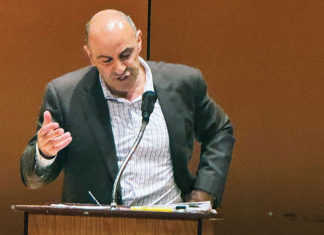 Jimmy Panetta Stresses Impacts of Budget Cuts on Local Health Man speaking at a podium