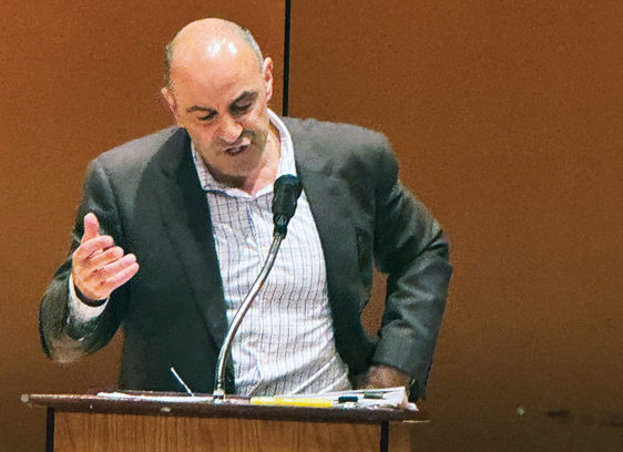 Jimmy Panetta Stresses Impacts of Budget Cuts on Local Health Man speaking at a podium