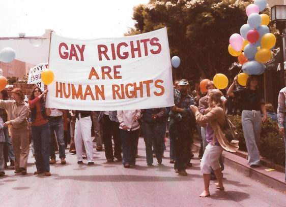 Out of the Closet and Into the Streets cover story image: a gay rights banner