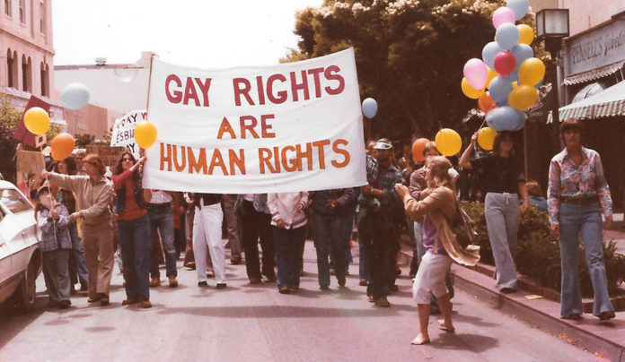 Out of the Closet and Into the Streets cover story image: a gay rights banner