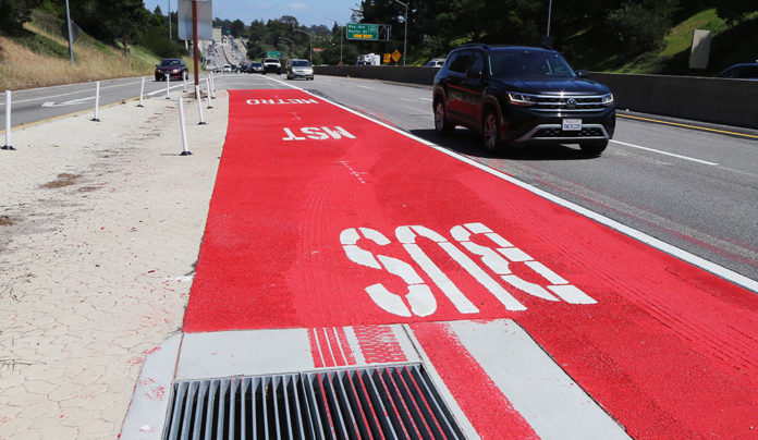 Seeing Red? Highway 1 Bus Lanes Explained Lanes of the freeway with one painted bright red