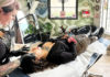Woman at a salon working on the brows of a client