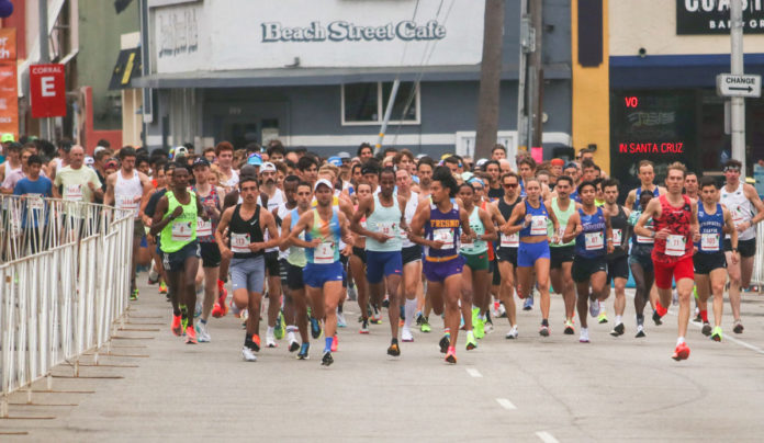 Where to Find Wharf to Wharf Race Participants This Year Runners getting ready to start a raice on a city street