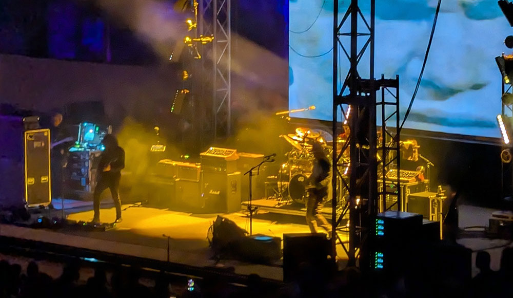 Musicians on a stage as seen from the audience