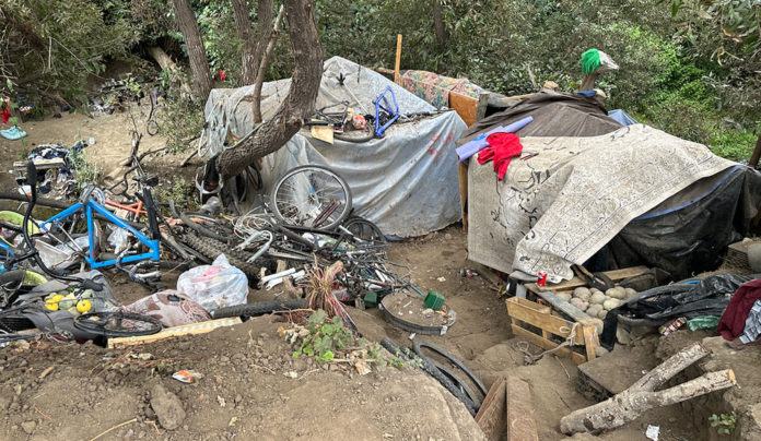Homeless Numbers Hit Lowest Point debris at homeless encampment