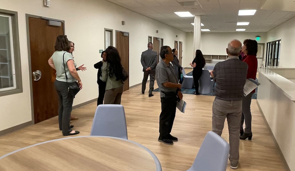 People inside a building at a press event