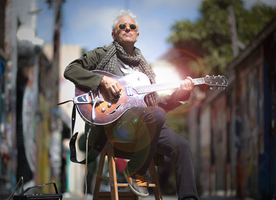 Divine Connection Jai Uttal playing guitar