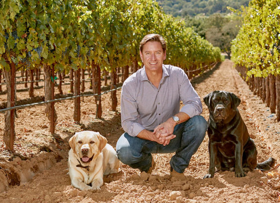 Trading Up man and dog and grape vines