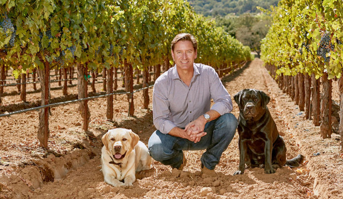 Trading Up man and dog and grape vines