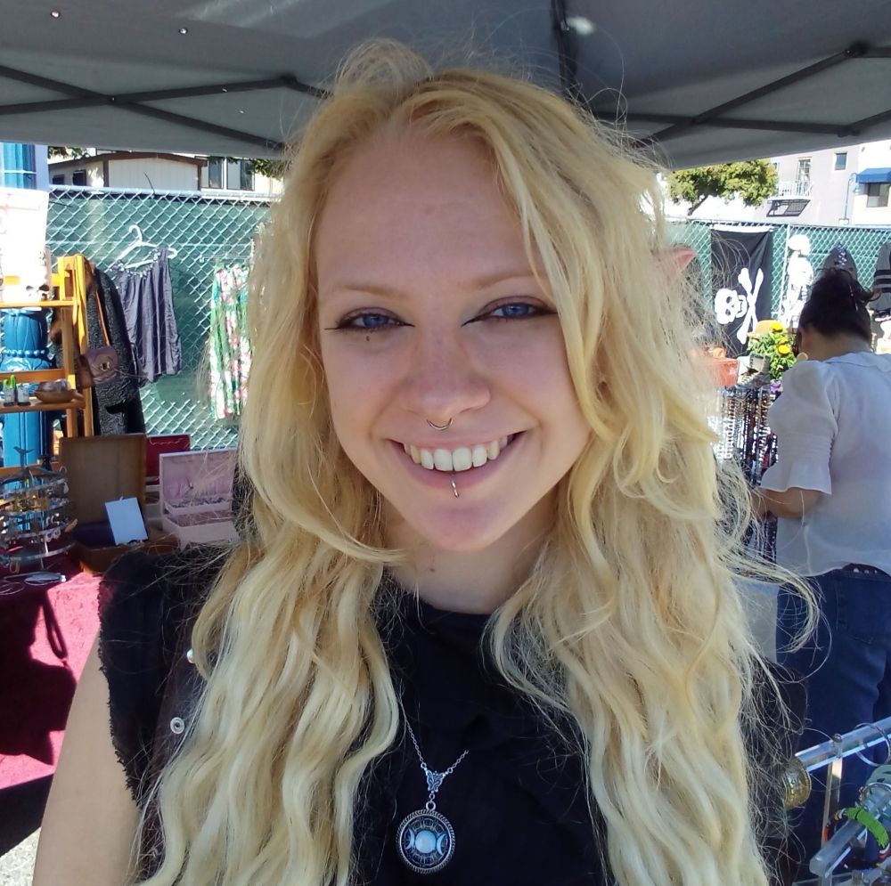 22 year old blonde in black interviewed for Good Times Street Talk