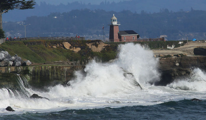 The Editor’s Desk waves crashing against Lighthouse Point