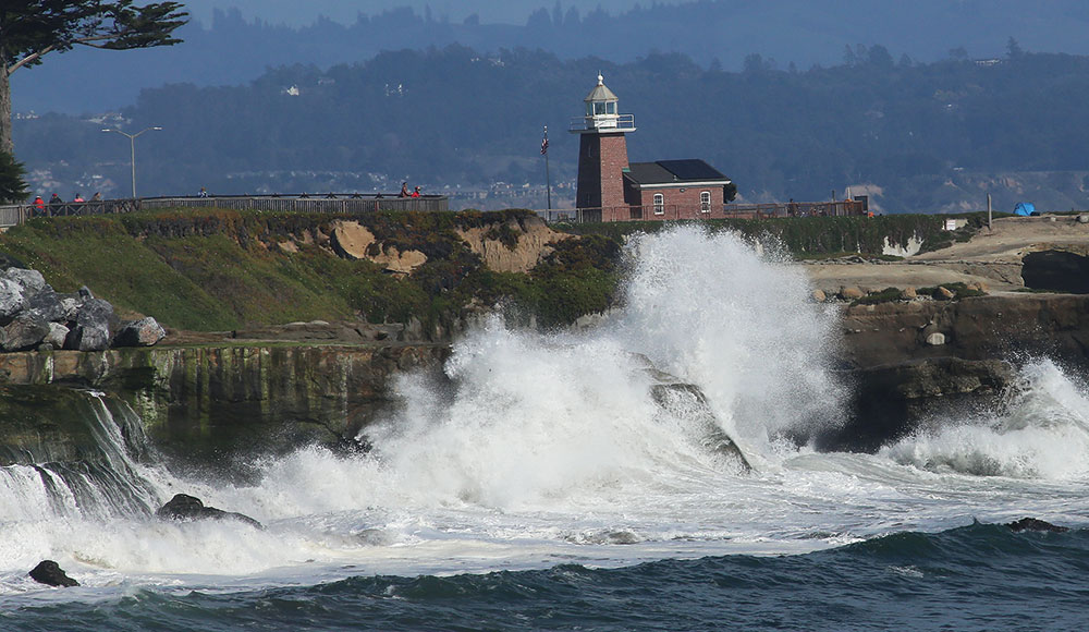 Lighthouse Point in waves waves crashing against Lighthouse Point