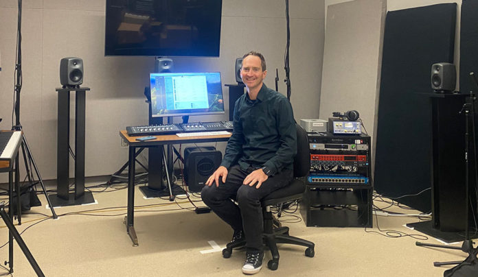 Diving into Immersive Audio at Cabrillo College Man sitting in a room surrounded by electronic equipment