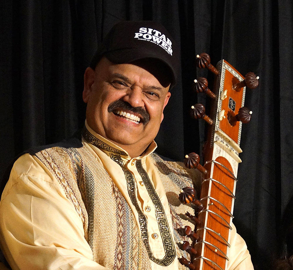 Man holding a sitar