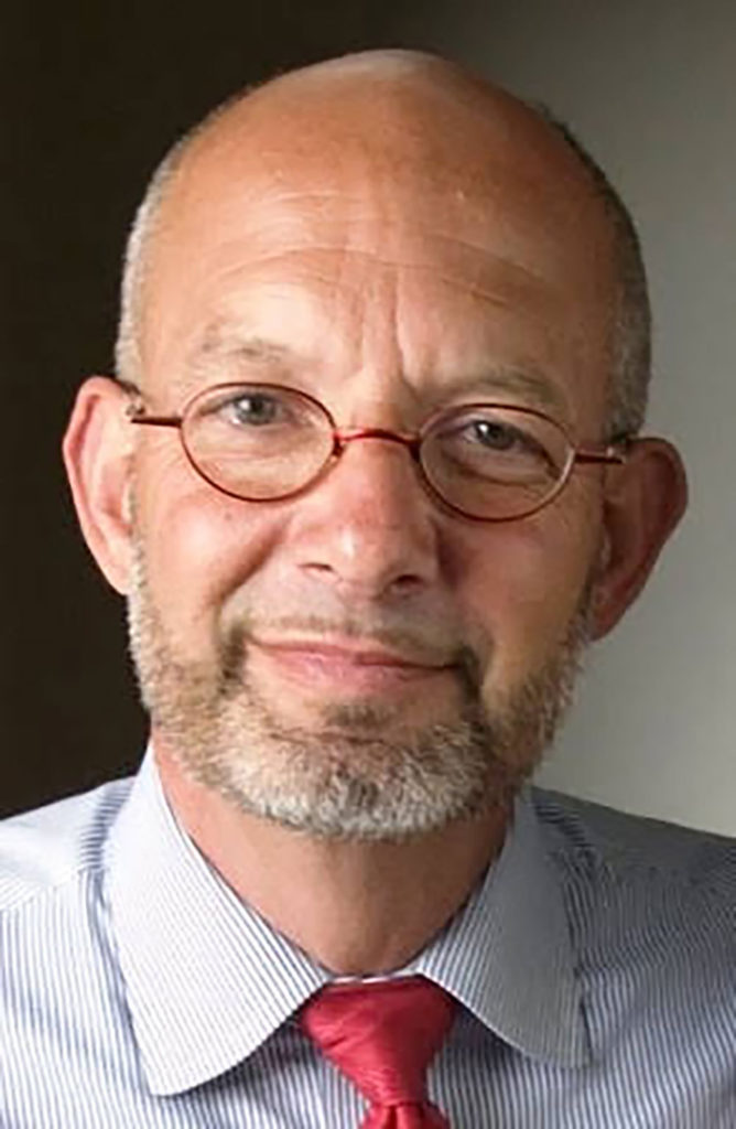 Head shot of a man in shirt and tie